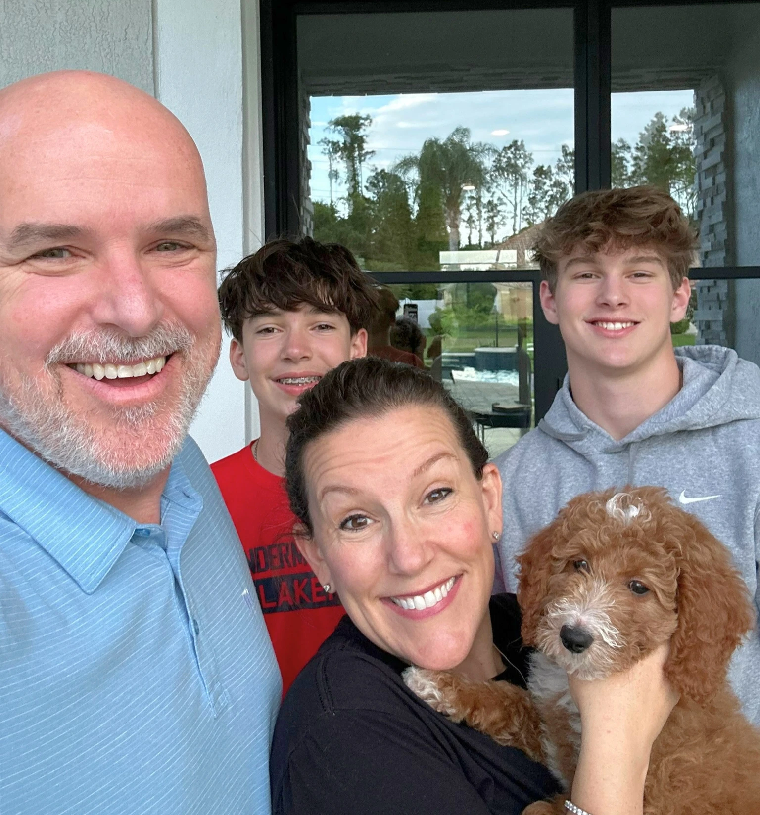 Funk Family with their dog, Boxer at their Windermere home